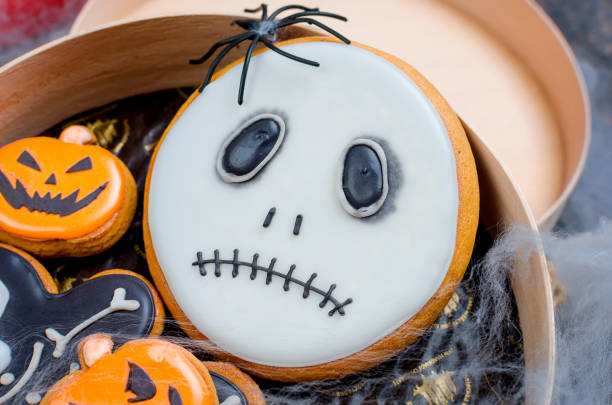 istock Halloween background with gingerbread, pumpkins and candles 1063831716