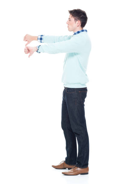 istock Handsome young man showing two thumbs doown 1063831764