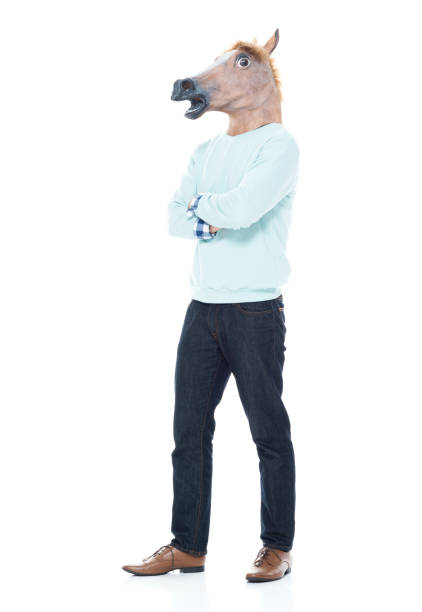 istock Man with horse mask standing with arms folded 1063831862