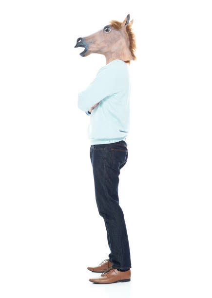 istock Man with horse mask standing with arms folded 1063831872