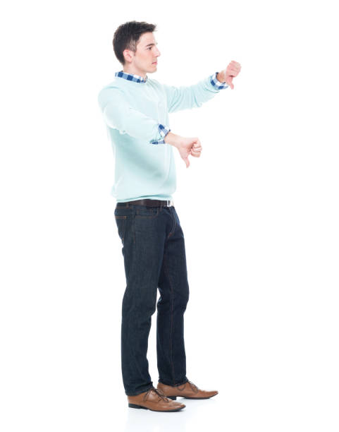 istock Handsome young man showing two thumbs doown 1063831880