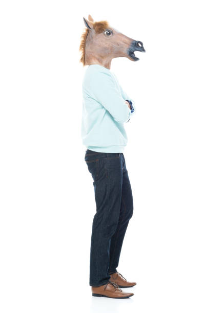 istock Man with horse mask standing with arms folded 1063831894