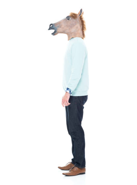 istock Man with horse mask standing with hands by his side 1063831916