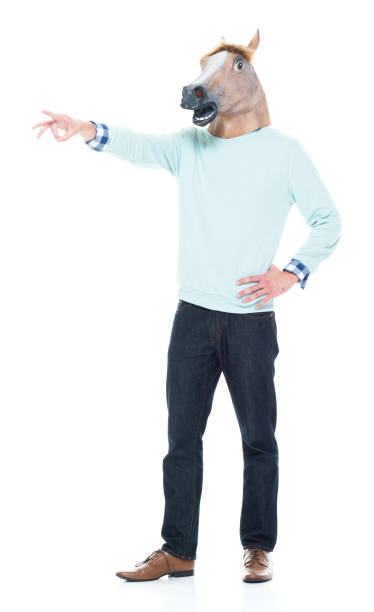 istock Man with horse mask standing and pointing 1063832042