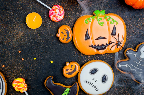 istock Halloween background with gingerbread, pumpkins and candles 1063832222