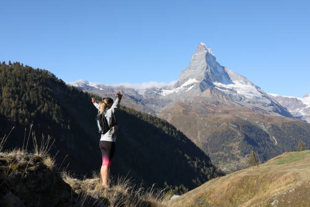 istock Young hiker stretches while admiring the view 1063834626