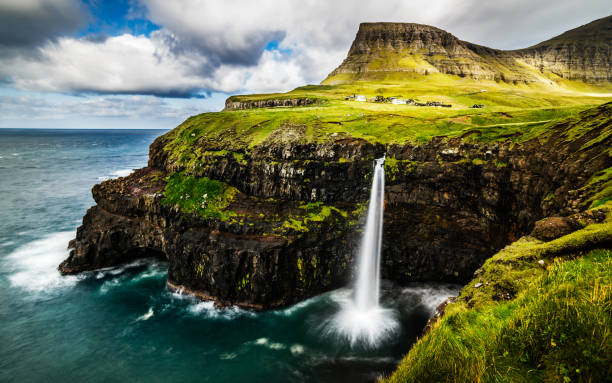 istock View on Mulafossur waterfall, Faroe Islands 1063834634