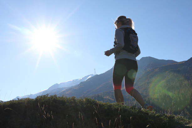 istock Young woman trail running in the sun 1063834636
