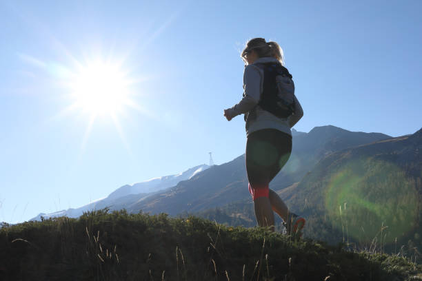 istock Young woman trail running in the sun 1063834644