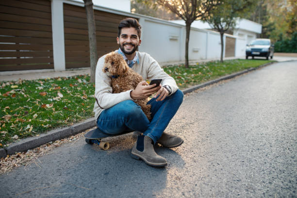istock Skater Having a Break With His Dog 1063835232