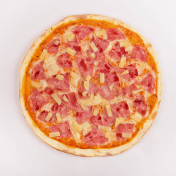 istock Pizza with ham and pineapple on a white 1063835438