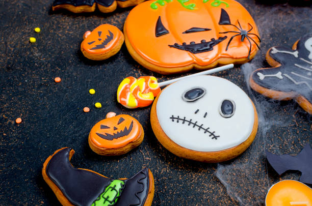 istock Halloween background with gingerbread, pumpkins and candles 1063835648