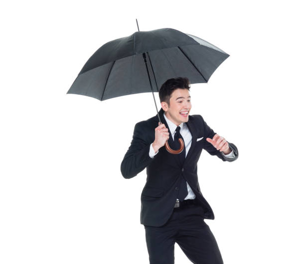 istock Handsome businessman holding an umbrella 1063835768