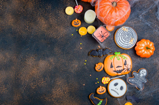 istock Halloween background with gingerbread, pumpkins and candles 1063835796
