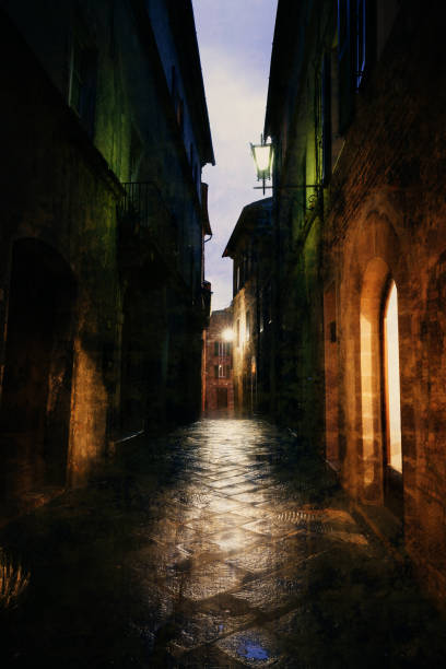 istock Old European illuminated street at rainy night 1063837284