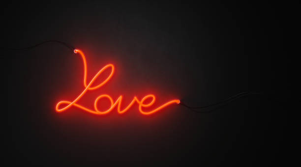 istock Love Written With Red Neon Light On Black Wall - Valentines Day Concept 1063837450