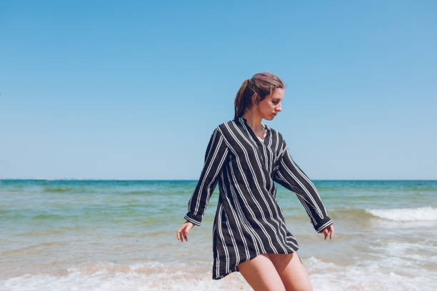 istock Woman dancing on the beach 1063844438