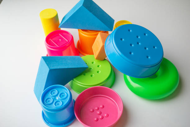 istock colored educational toys for babies, cubes, pyramids, cones, rings 1063850012