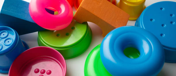 istock colored educational toys for babies, cubes, pyramids, cones, rings 1063850396