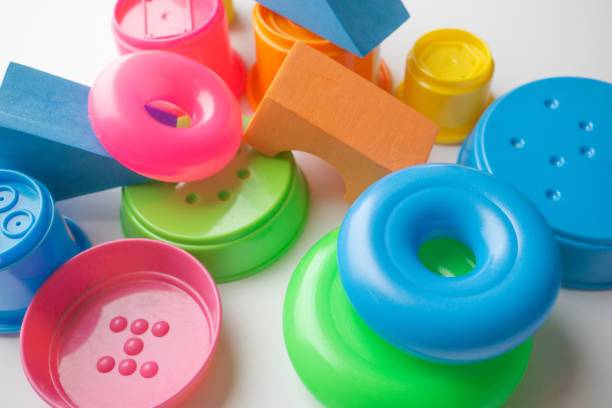 istock colored educational toys for babies, cubes, pyramids, cones, rings 1063850410