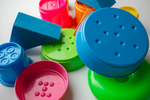 istock colored educational toys for babies, cubes, pyramids, cones, rings 1063850438