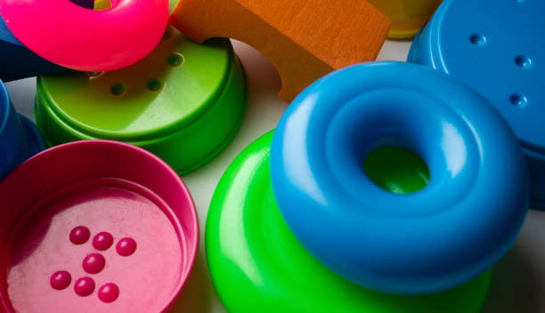 istock colored educational toys for babies, cubes, pyramids, cones, rings 1063850478