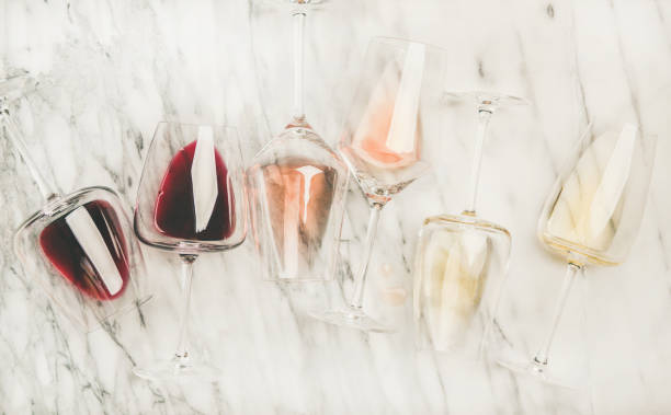 istock Red, rose, white wine in glasses and corkscrews 1063853386