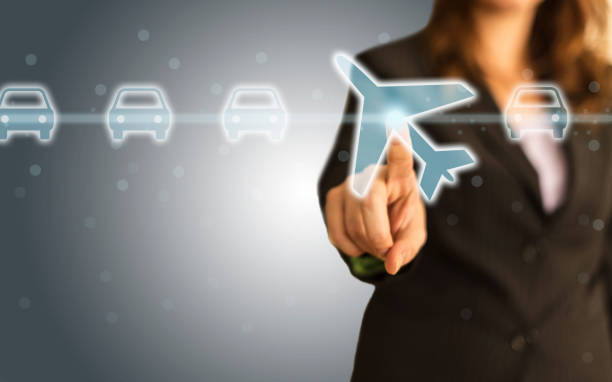 istock Businesswoman select a flight by touch screen airplane button 1063855290