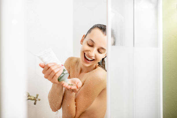istock Woman with shampoo in the shower 1063860756