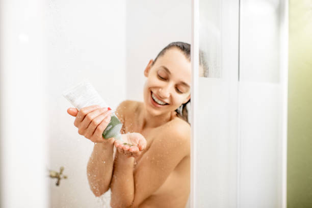 istock Woman with shampoo in the shower 1063860764