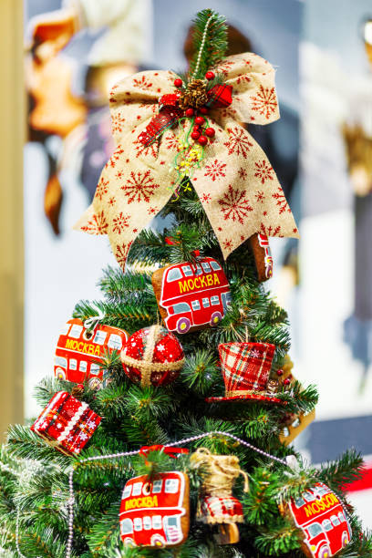 istock Fir tree decorated with gingerbread in shape of double decker bus (with word Moscow) and fabric balls for Christmas and New Year celebration. Moscow, Russia. 1063862242