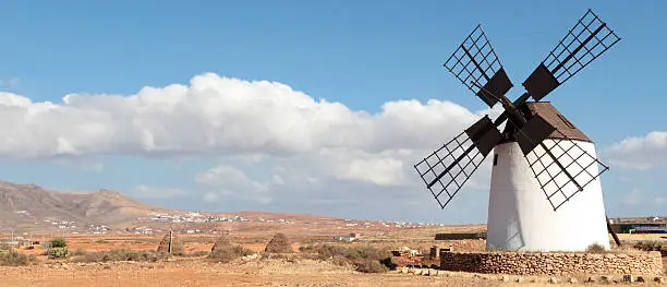 Photo of Traditional Tower Windmill in a Rustic Landscape, Fuerteventura, Canary Islands