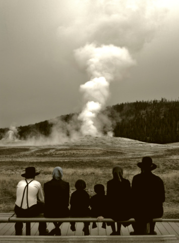 Tourists at Upper Geyser Basin in Yellowstone National Park at Teton County, Wyoming