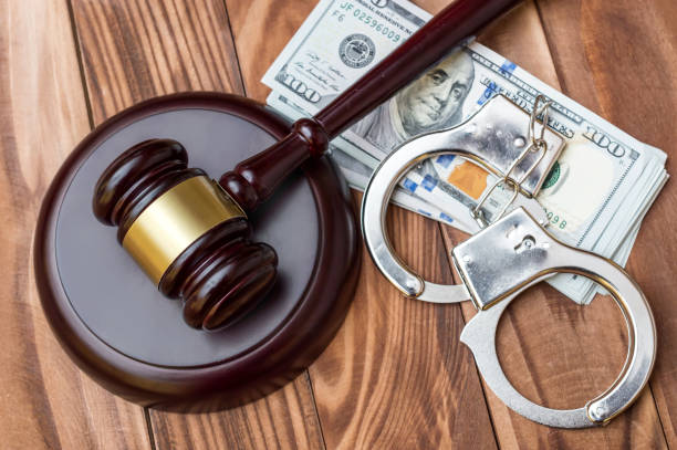 istock Gavel, handcuffs and money on the table.Top view. 1063868492