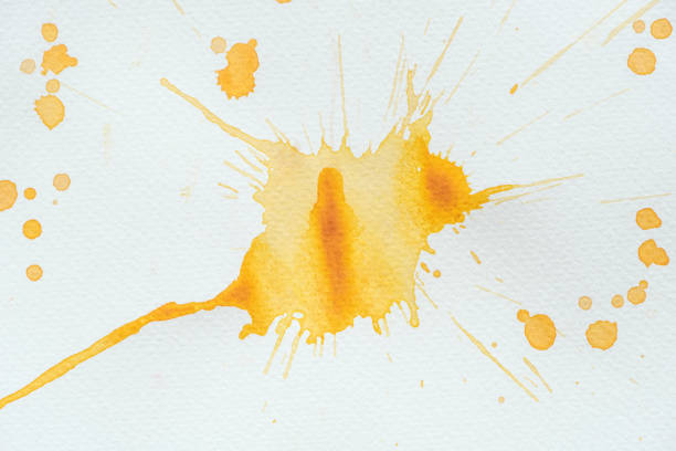 istock abstract orange watercolor splatter on white paper 1063869222