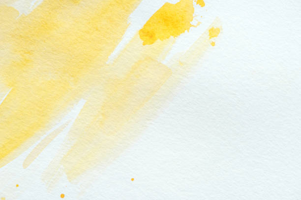 istock abstract yellow watercolor strokes on white paper 1063869512