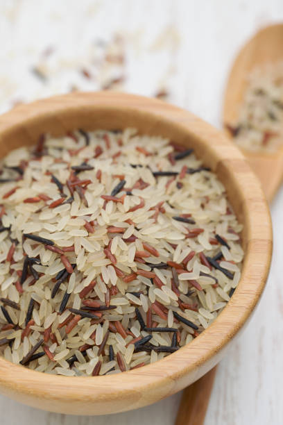istock mix of white, brown and black rice in bowl 1063869710