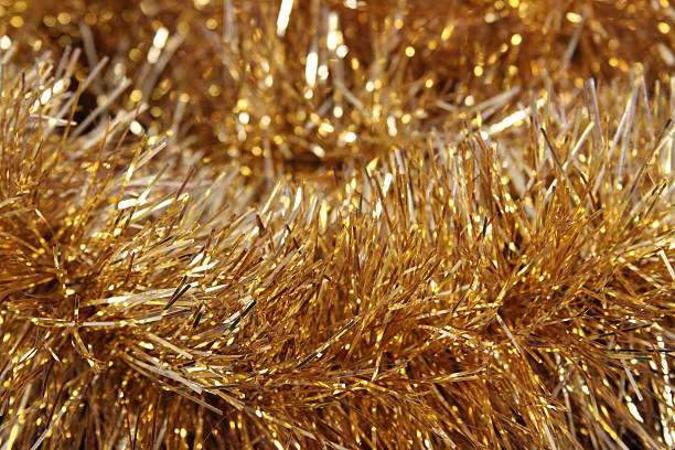 Gold Tinsel Christmas background, gold tinsel. tinsel stock pictures, royalty-free photos & images