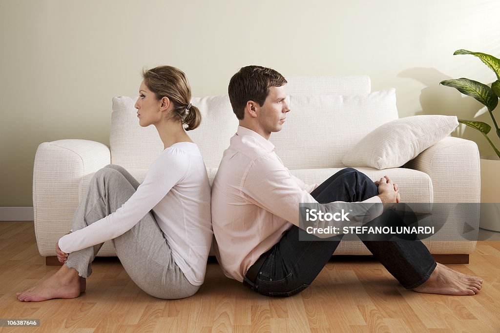 Couple Crisis Young couple with relationship difficulties Back To Back Stock Photo