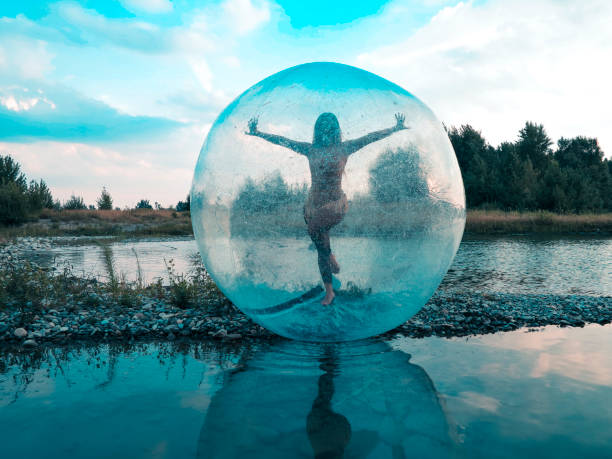 Water sphere Bubble, Splashing, Activity, Drop, Females zorbing stock pictures, royalty-free photos & images