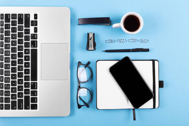 istock Blue office desk table with a lot of things on it. Top view with copy space. 1063881412
