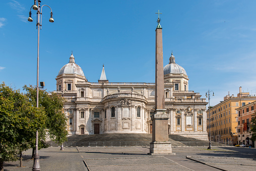 Obelisk at Piazza dell'Esquilino and the apse and domes of Basilica Santa Maria Maggiore at Rome, Italy. Located on the hill of Esquilino district, the Basilica is visited daily by lot of pilgrims and tourist and it is an Unesco World Heritage Site.