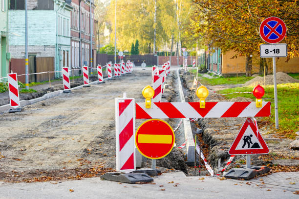 istock traffic constraints during street repairs, warning signs 1063886800