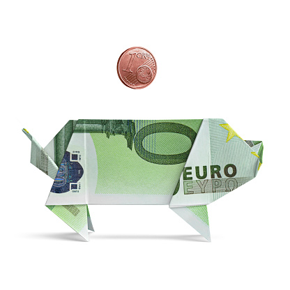 Euro piggy bank with one cent. Euro. Origami banknotes