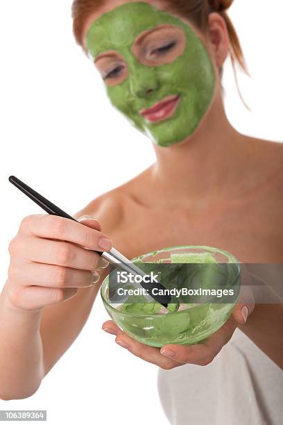 Body Care Series Young Woman Applying Green Facial Mask Stock Photo - Download Image Now