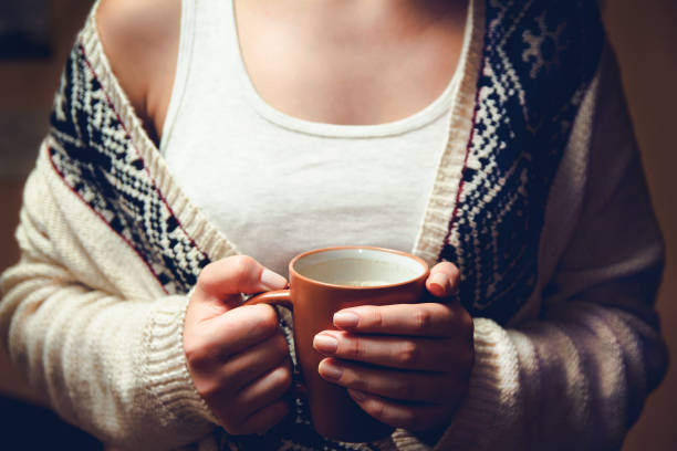 istock woman with a cup of coffee 1063894394