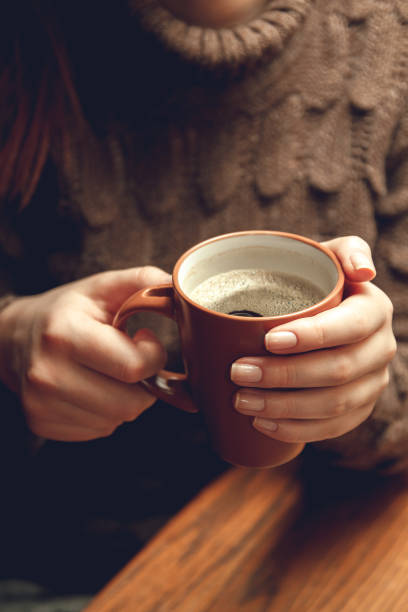 istock woman with a cup of coffee 1063894406