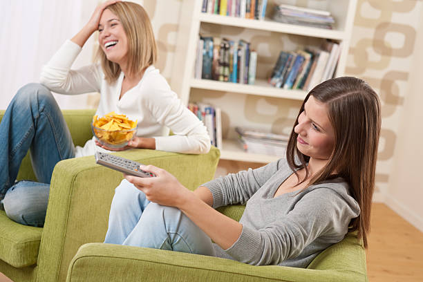 istock Students - Two female teenager watching television 106390178