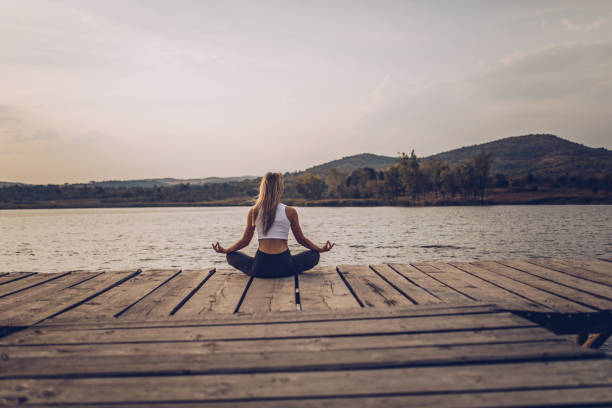 istock Yoga at the lake 1063903166