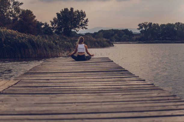 istock Yoga meditation at the lake 1063904796